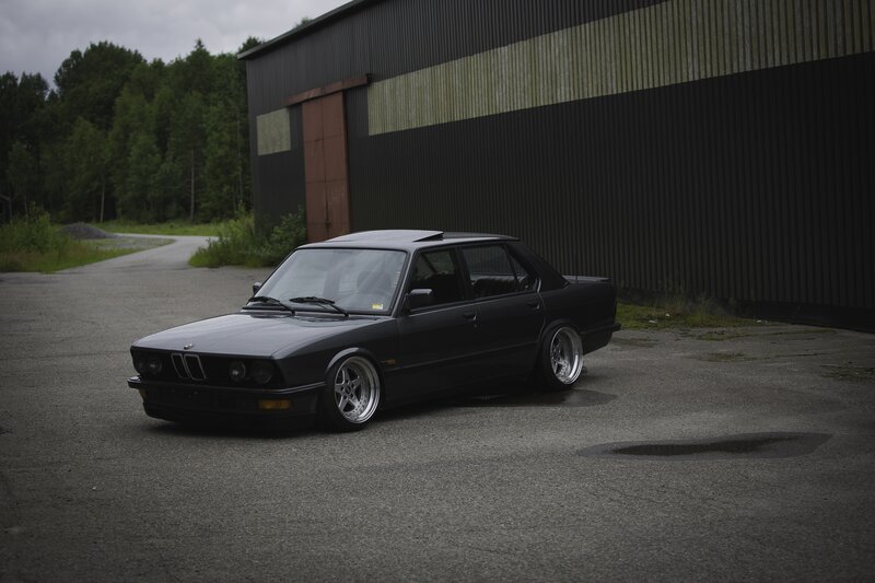 Black Bmw Sedan — Dramatic, Photograph, Building, Trees
