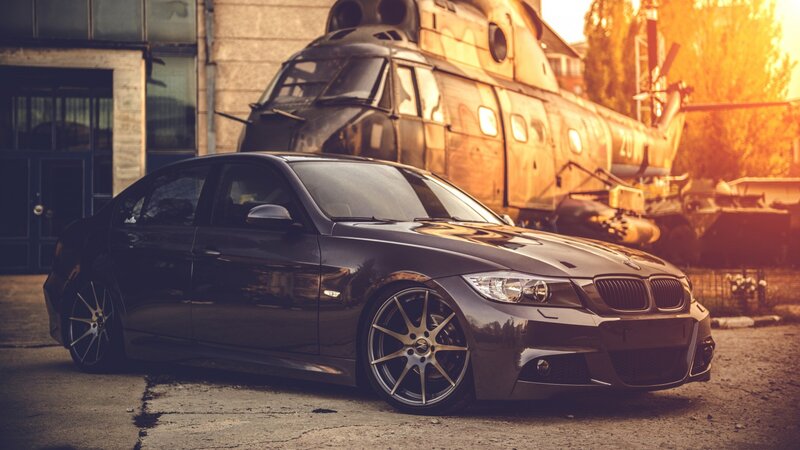 Black BMW Sedan — Dramatic, Sunset, Photograph, Helicopter, Building