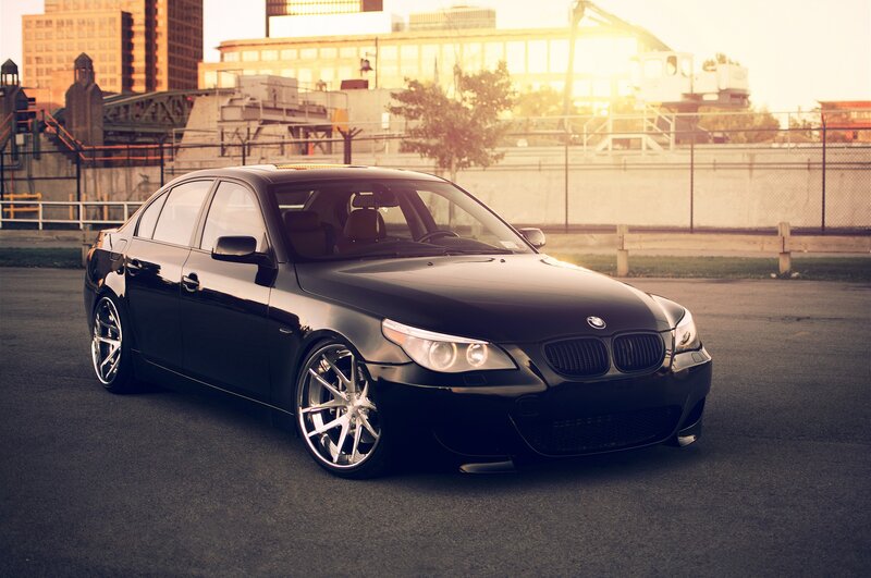 black bmw sedan in city