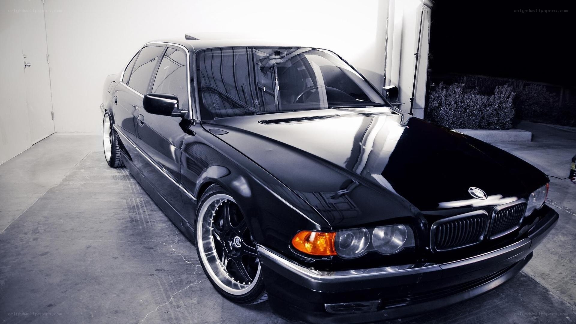 black bmw sedan in garage