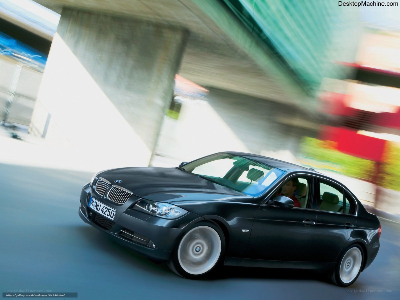Black BMW sedan in motion