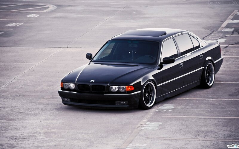 Black BMW sedan in parking lot