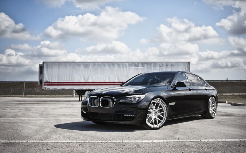 Black BMW sedan in parking lot