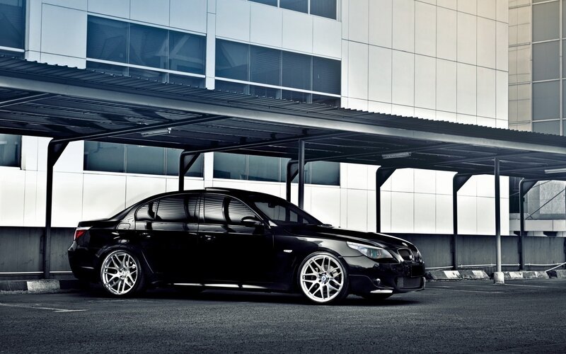 black bmw sedan in parking lot