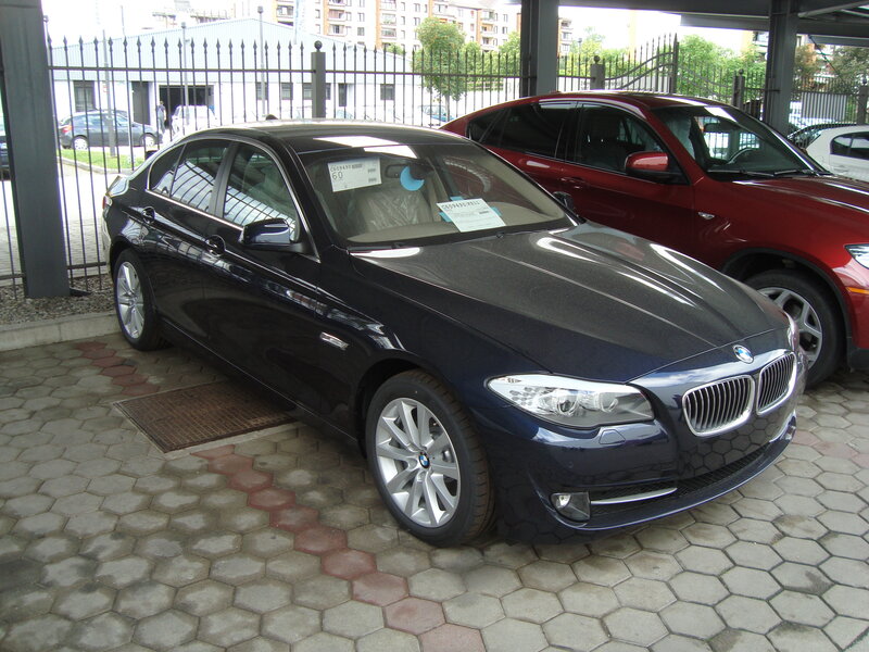 Black BMW sedan in parking lot