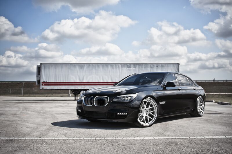 Black BMW sedan in parking lot