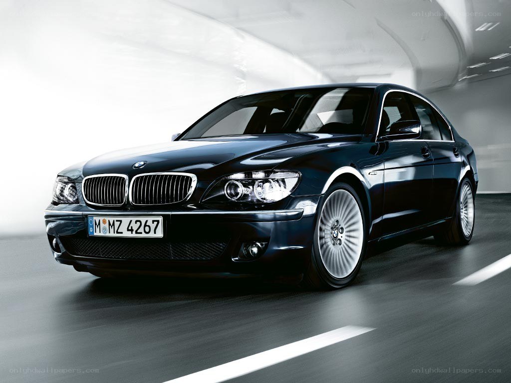 black bmw sedan in tunnel