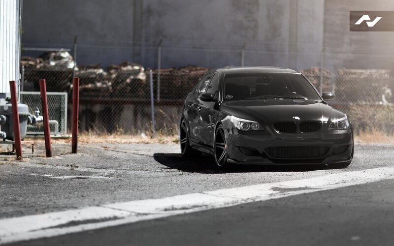 black bmw sedan on asphalt