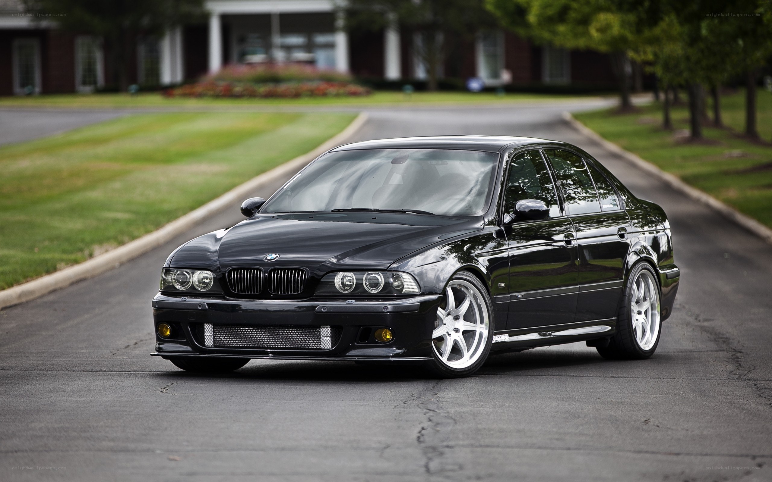 black bmw sedan on driveway