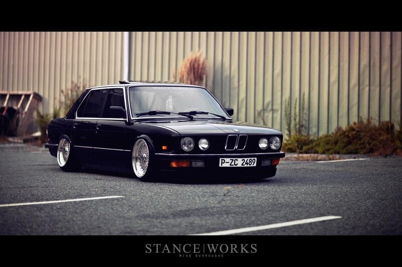 black bmw sedan on lowered suspension