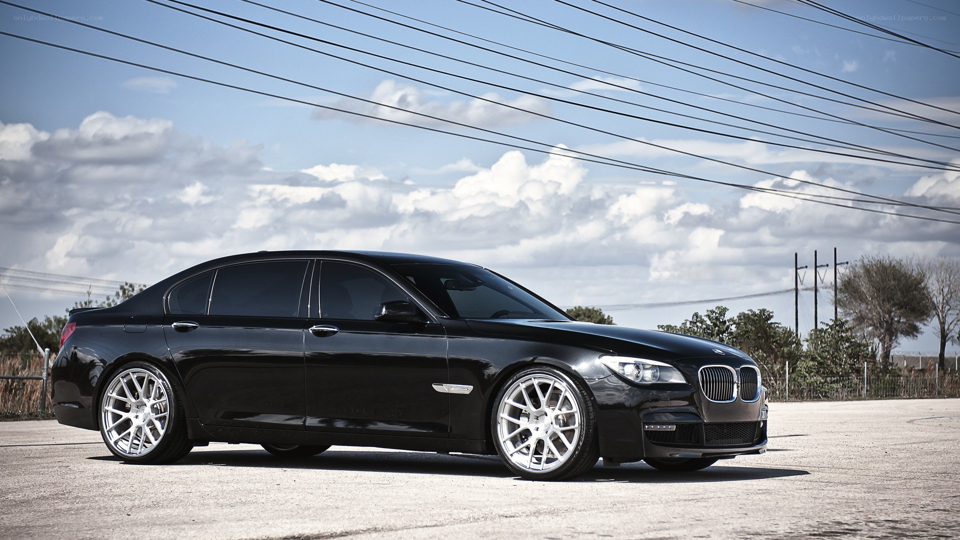 black bmw sedan on pavement