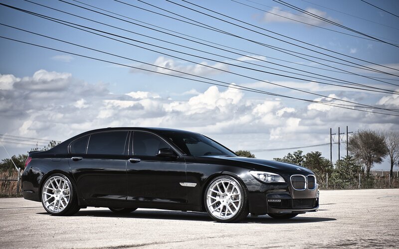 Black BMW sedan on pavement