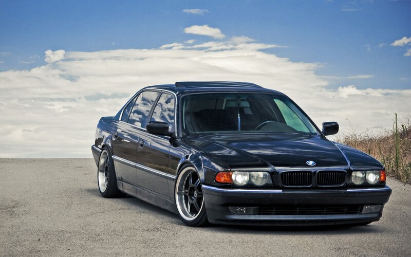 black bmw sedan on road