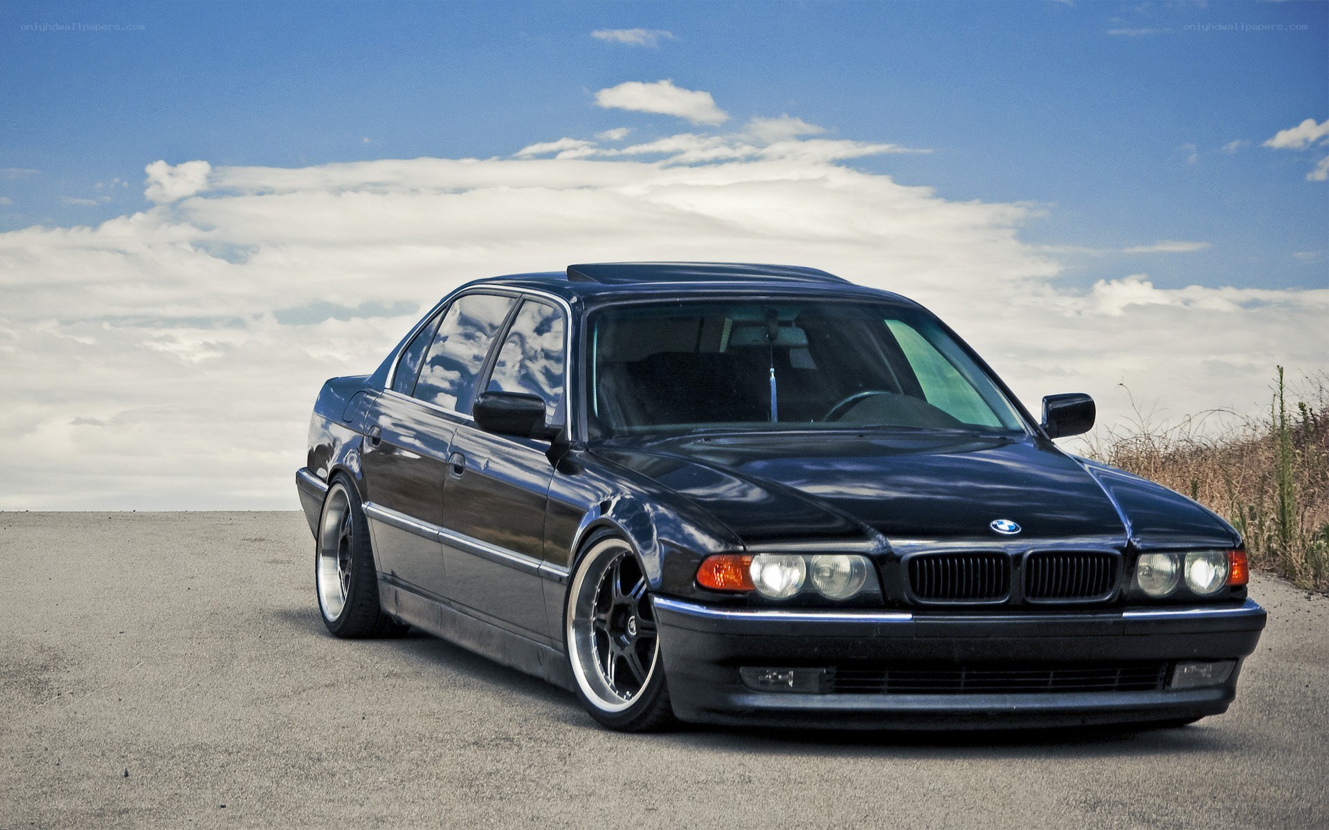 black bmw sedan on road