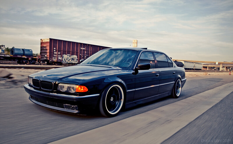 black bmw sedan on road