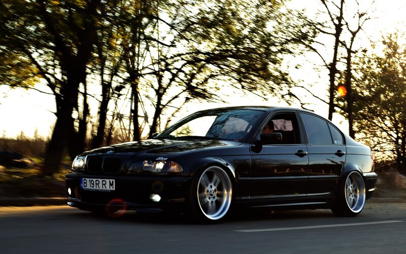 black bmw sedan on road