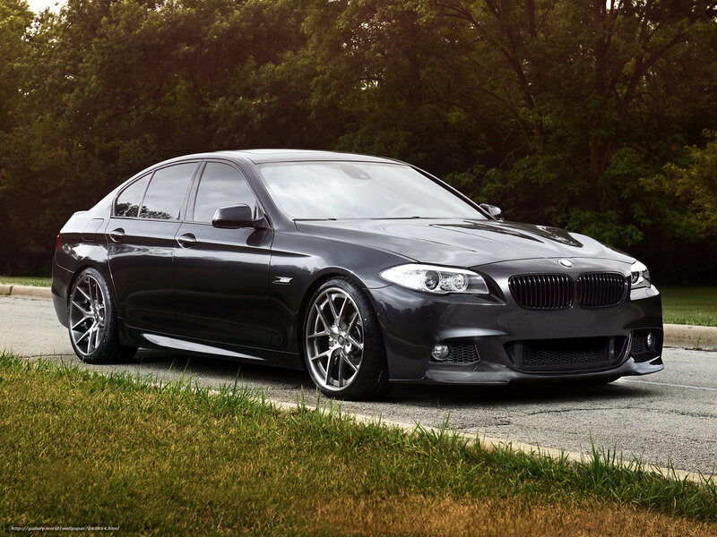 Black BMW sedan on road