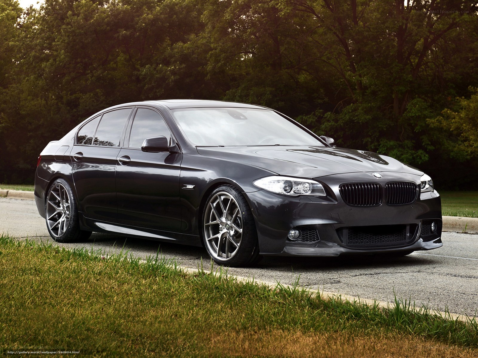 Black BMW sedan on road