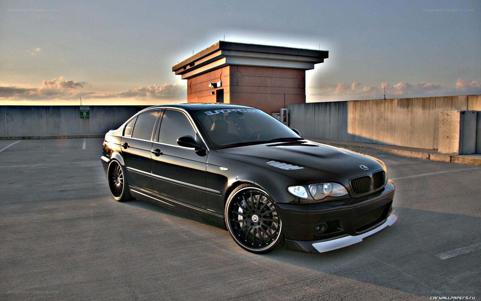 black bmw sedan on rooftop