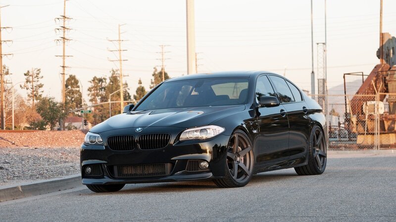black bmw sedan on street