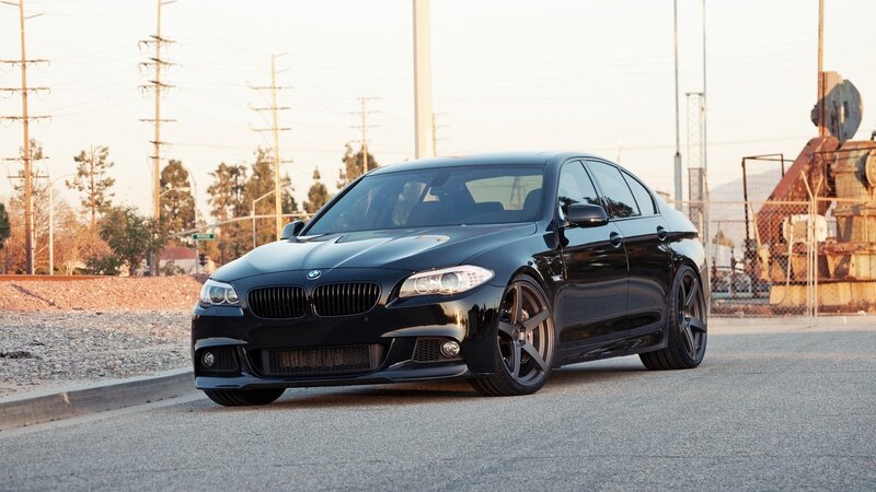 black bmw sedan on street