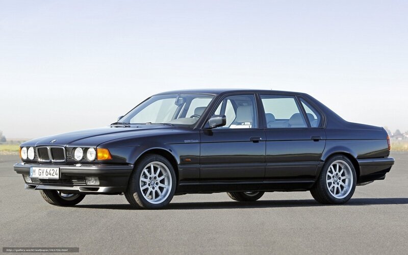 Black BMW sedan on tarmac