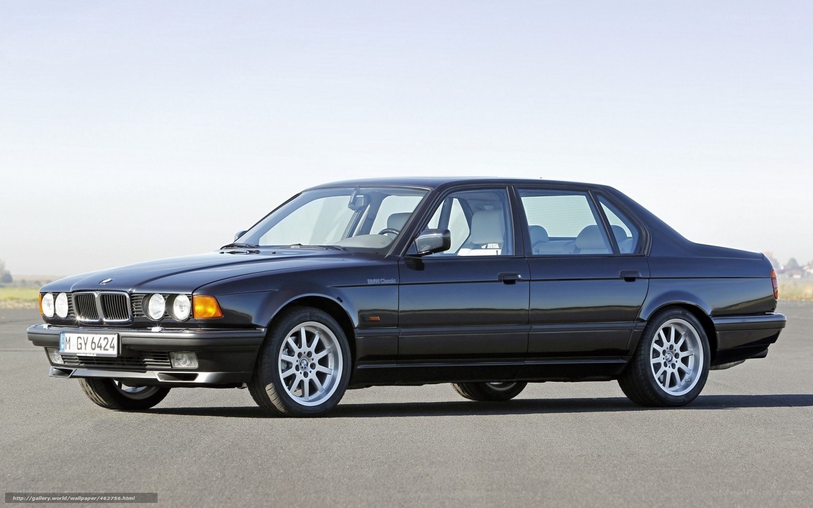 Black BMW sedan on tarmac