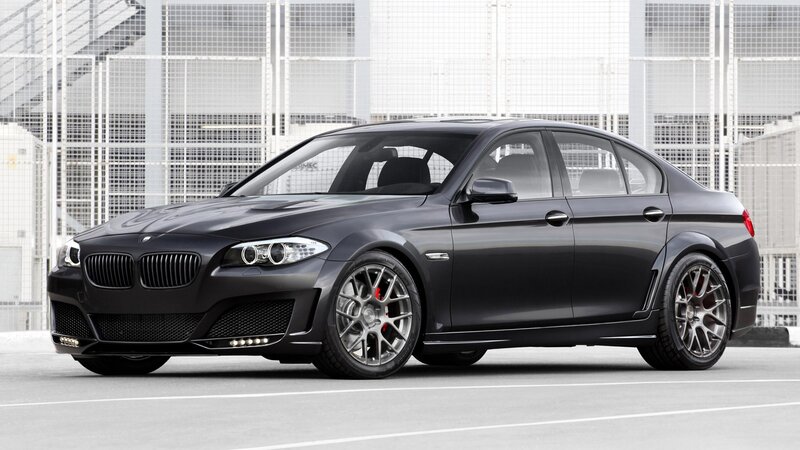 black bmw sedan on track