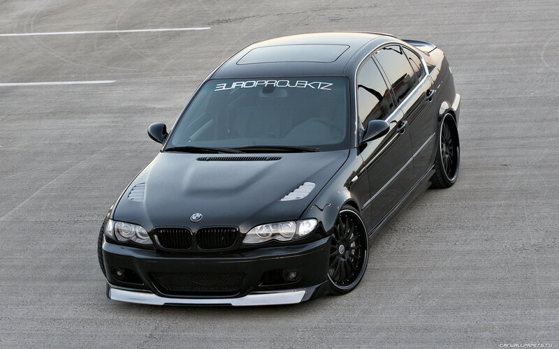 black bmw sedan on track