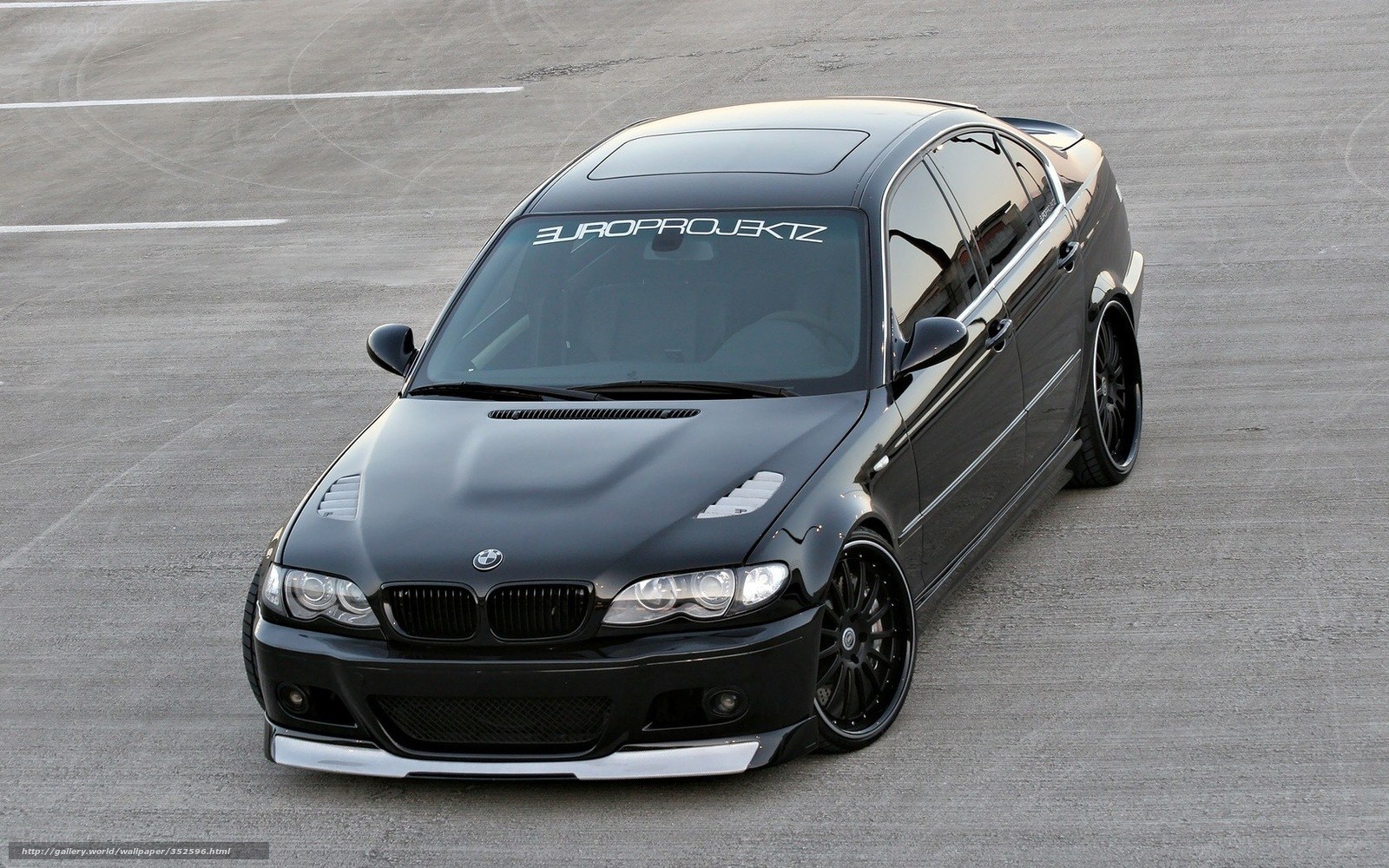 black bmw sedan on track