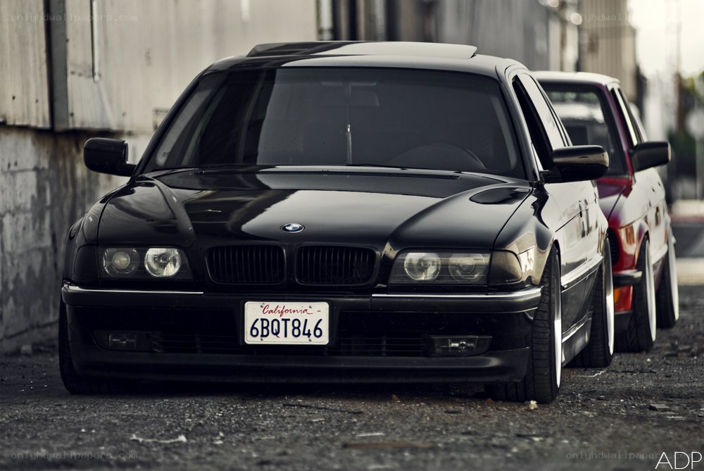 black bmw sedan parked