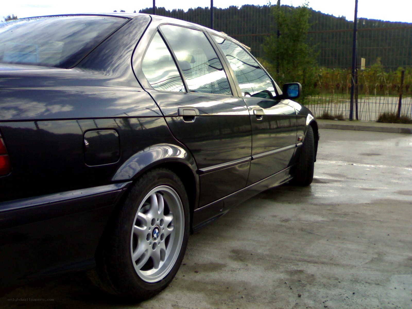 black bmw sedan parked