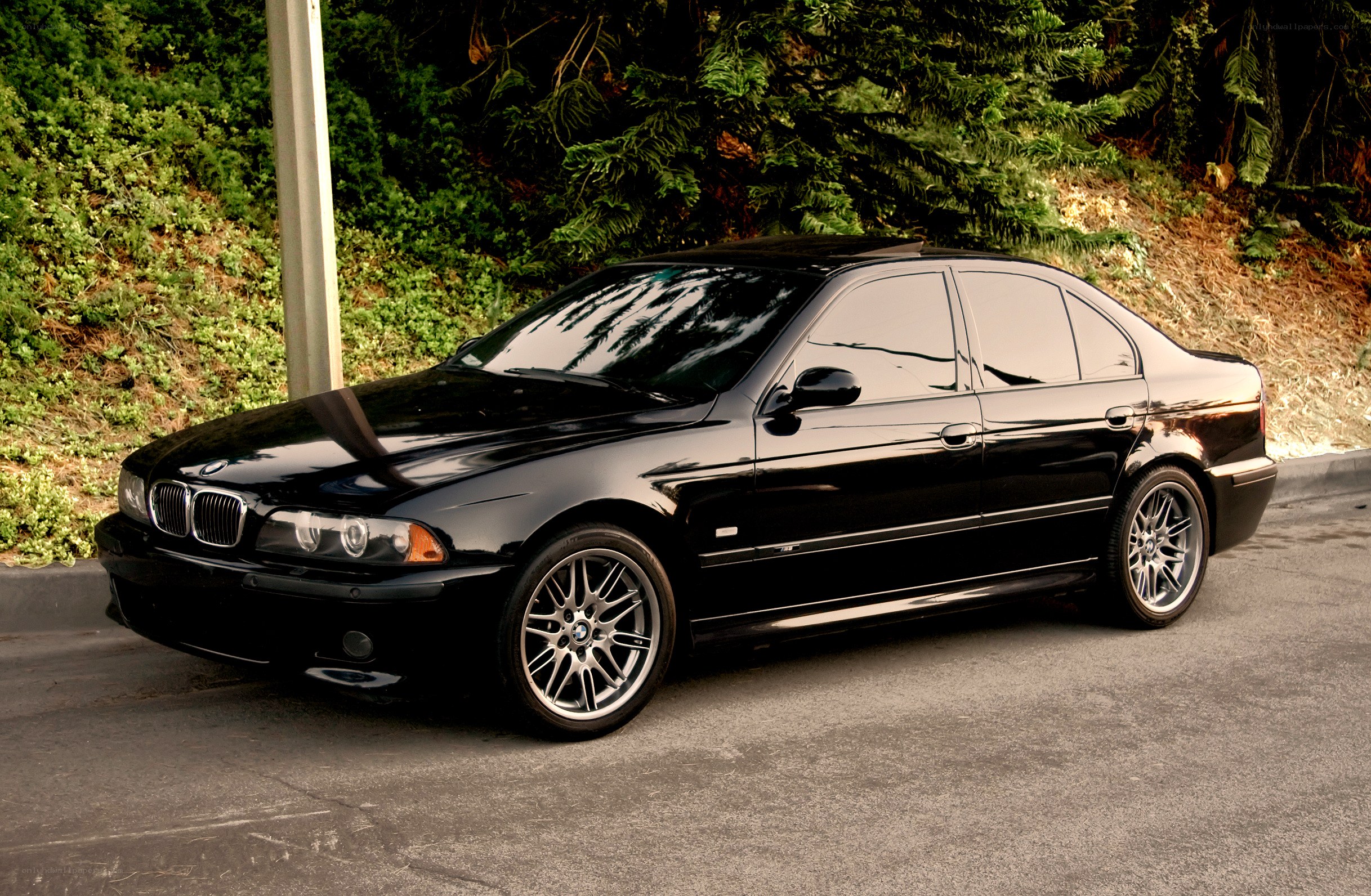 Black BMW sedan parked