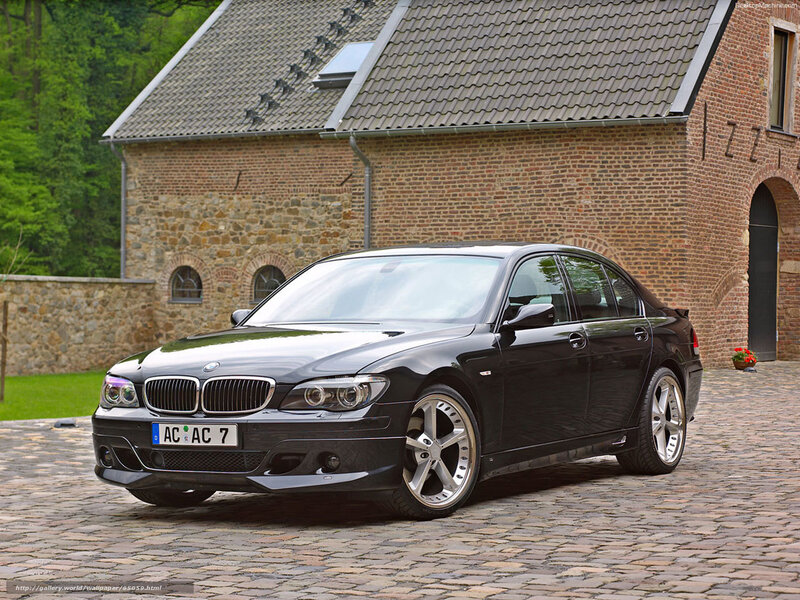 Black BMW Sedan — Serene, Afternoon, Photograph, Brick Building