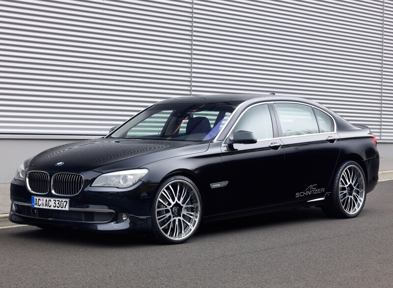 black bmw sedan with custom wheels