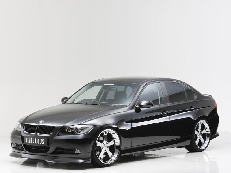 black bmw sedan with custom wheels