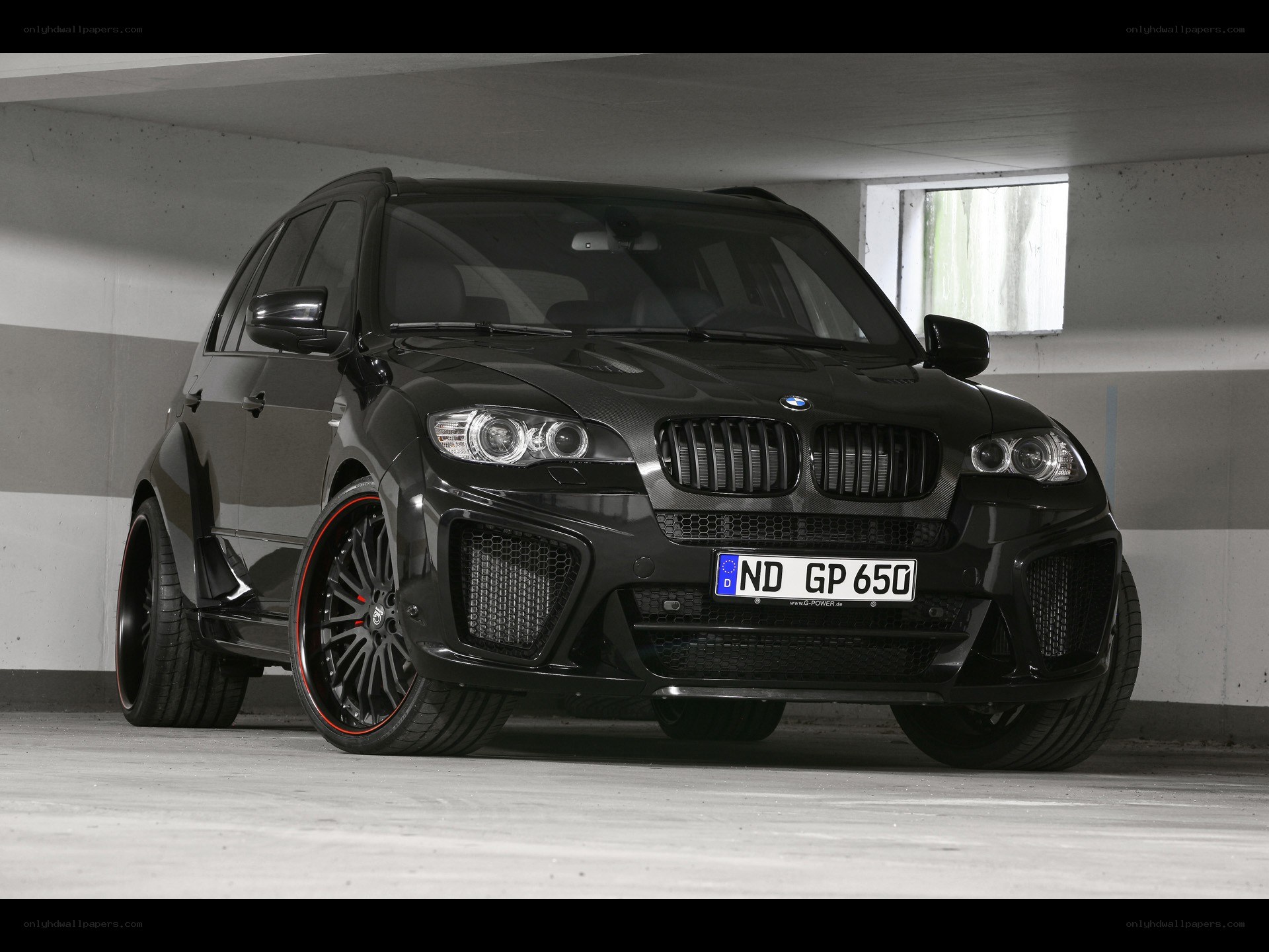 black bmw suv in garage