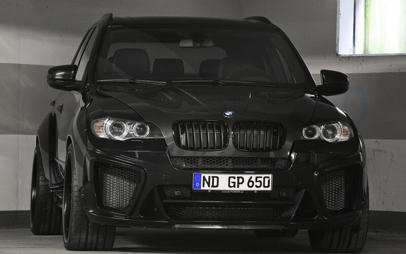 black bmw suv in garage
