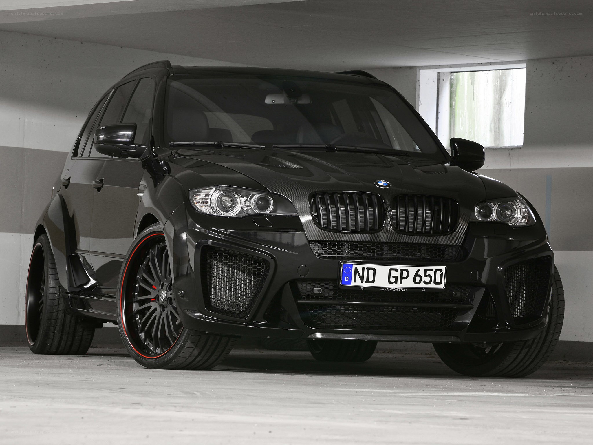 black bmw suv in garage