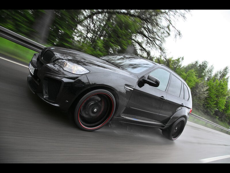 Black BMW SUV in motion