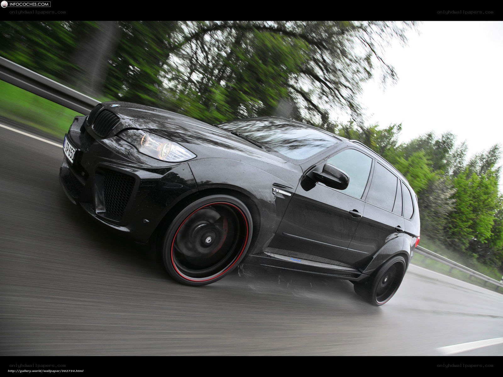 black bmw suv in motion
