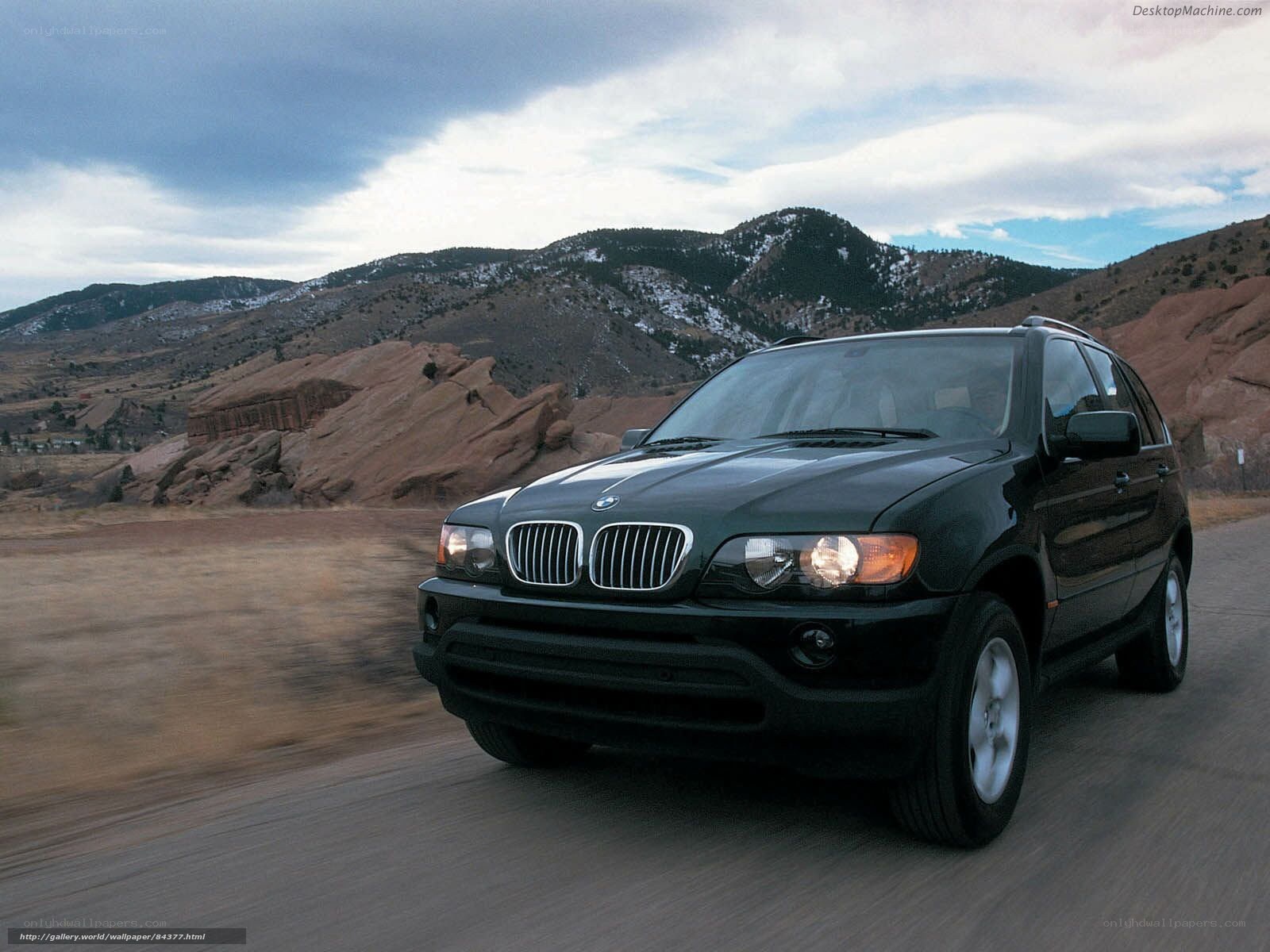 black bmw suv on mountain road