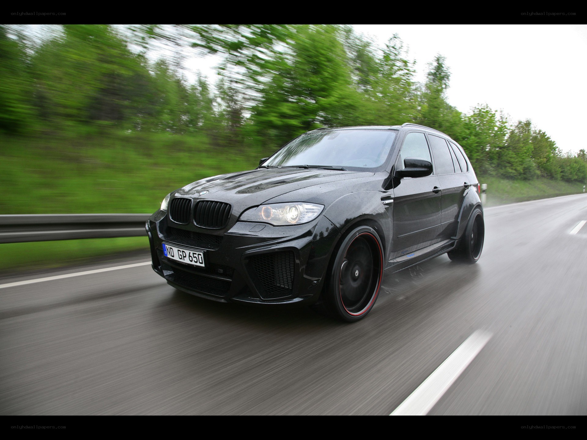 black bmw suv on road