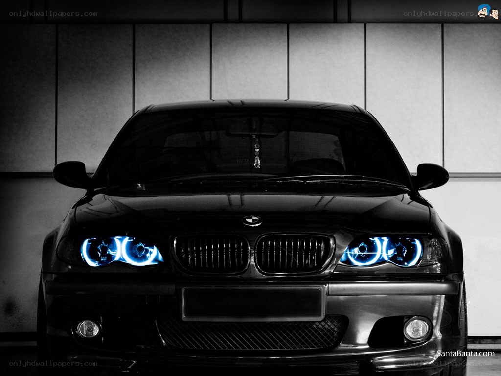 Black BMW with blue headlights
