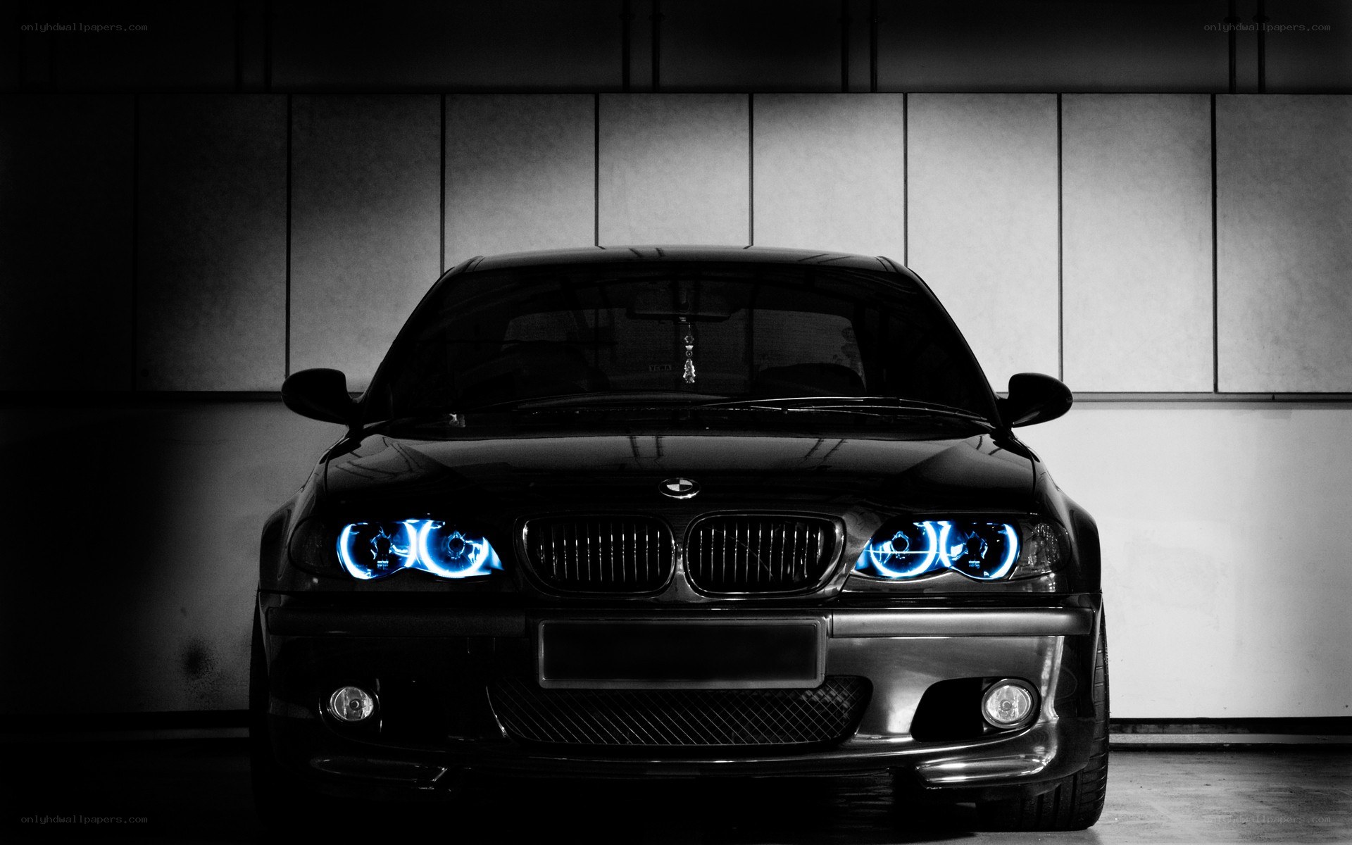 black bmw with blue headlights