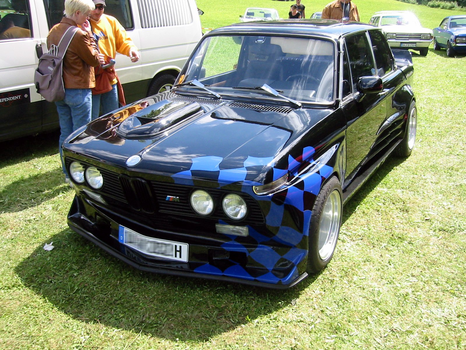 Black BMW with checkered livery