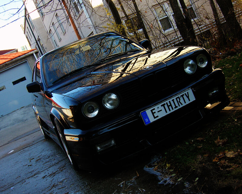 Black BMW with custom license plate
