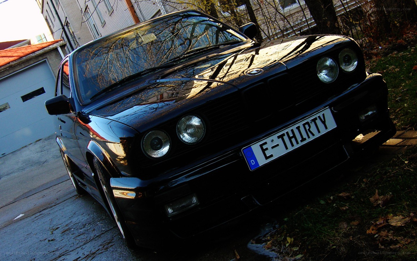 Black BMW with custom license plate