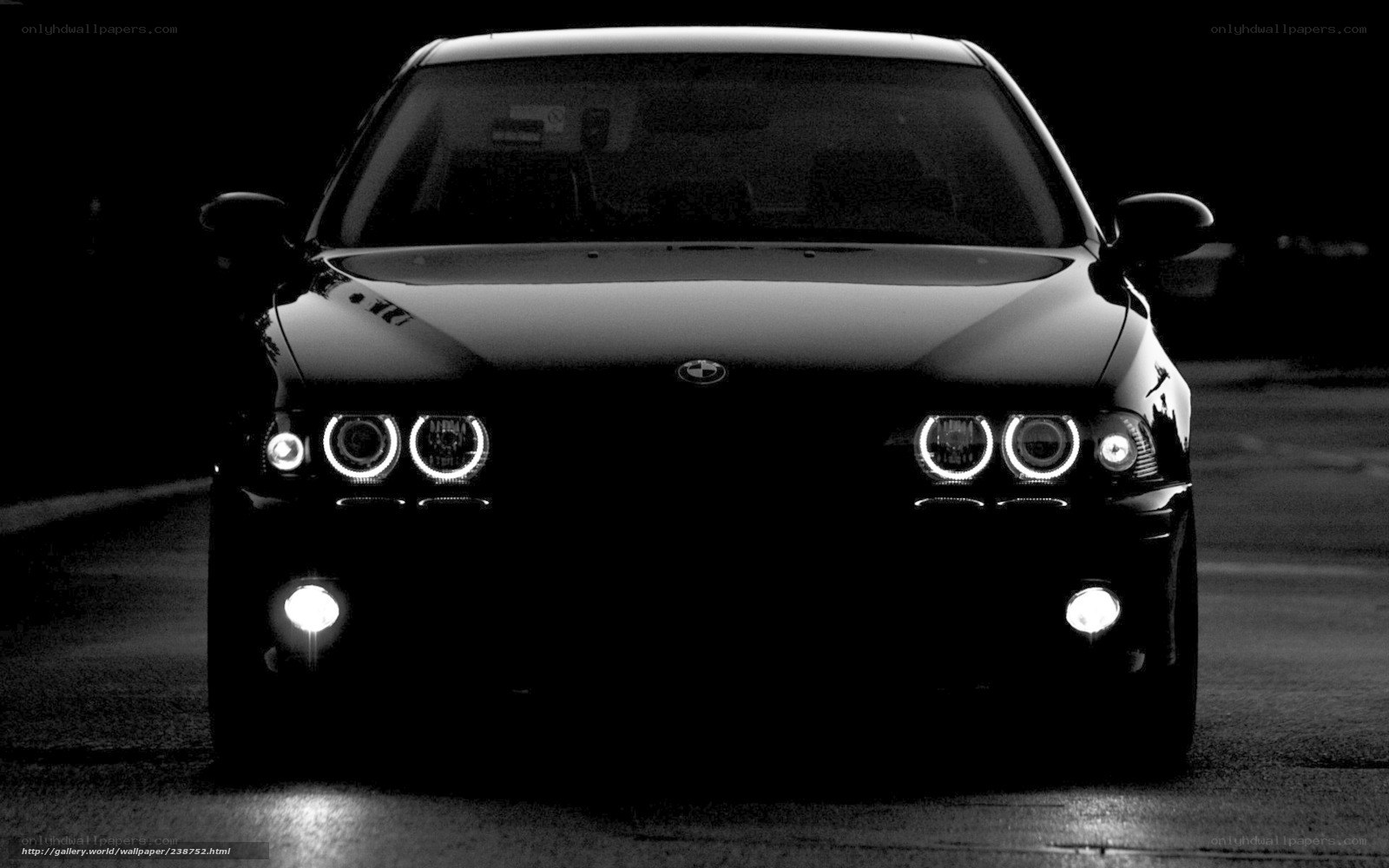 black bmw with headlights on