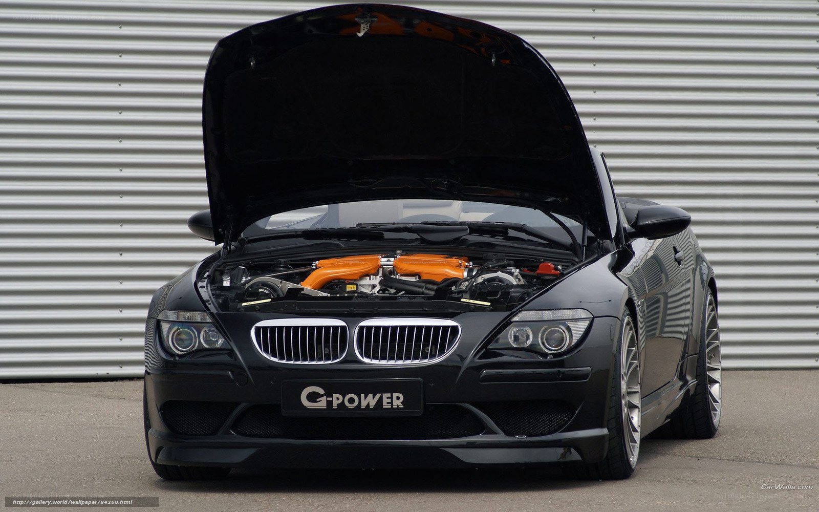 Black BMW with open hood
